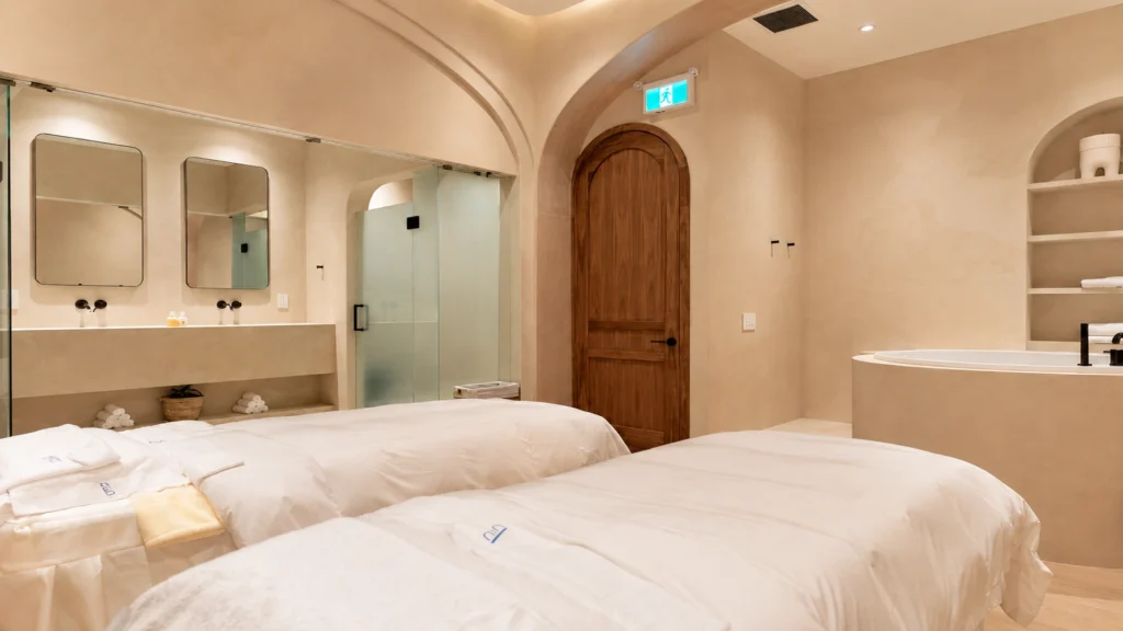 Serene, modern luxury spa hallway with soft warm lighting at Pemberley Springs near Bayview Village